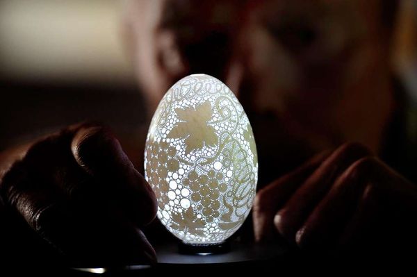 An egg shell with thousands of tiny holes drilled ...