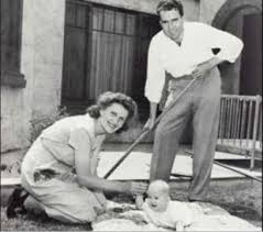 Richard and Pat Nixon with their first daughter, T...