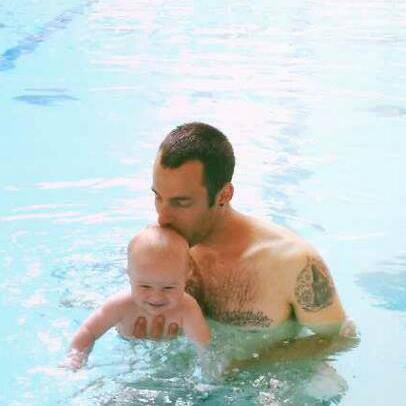 My son, his 4 month old son, my grandson, swimming...