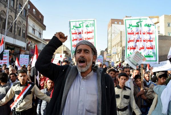 An elderly supporter of the Houthis shouts slogans...