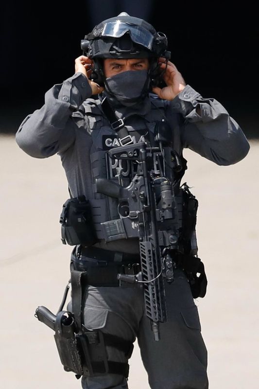 A member of the British security detail...