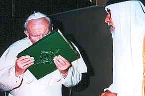 Pope John Paul II kissing Qur'an w/Patriarch Rapha...