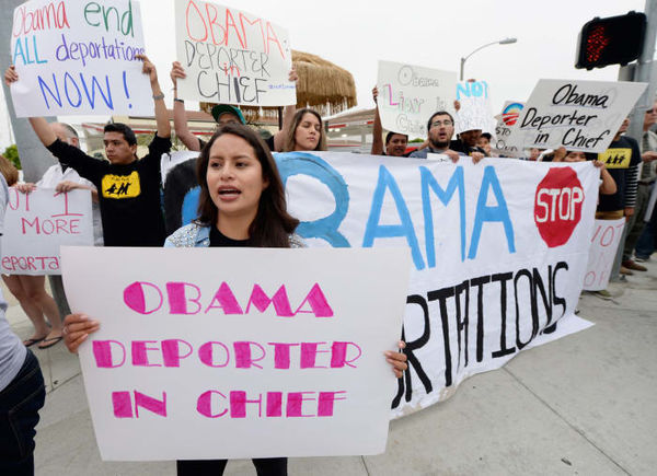 Protestors during a visit by President Barack Obam...