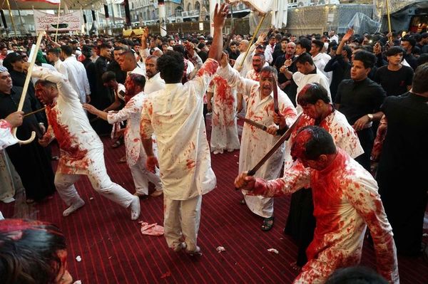 Muslims slice open their heads with swords during ...